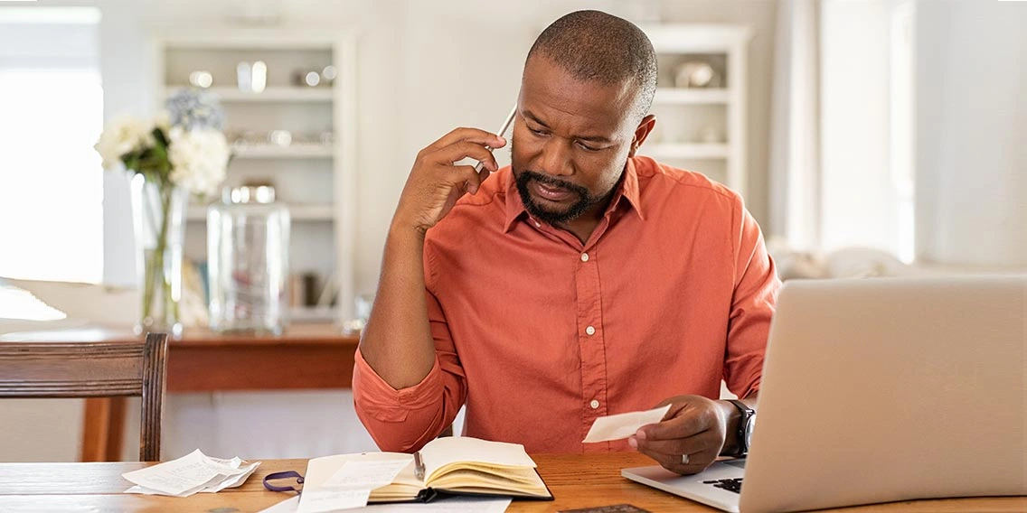 man paying off credit card debt