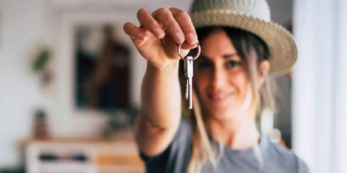 A lady holding a key