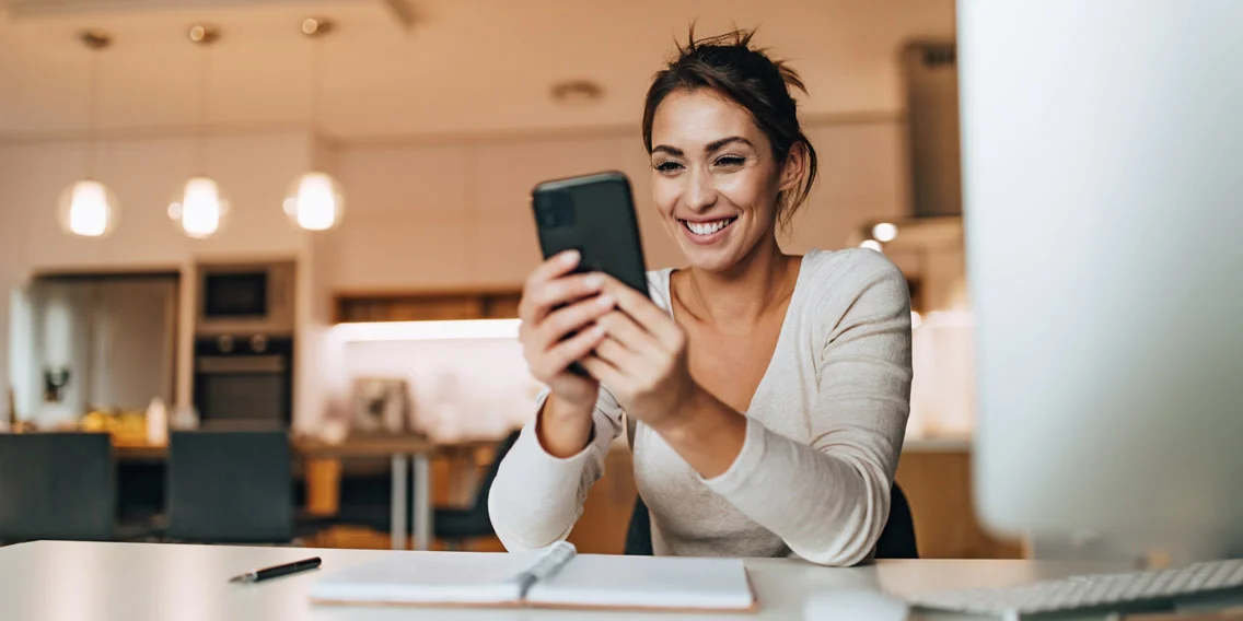 woman interacting with her mobile phone