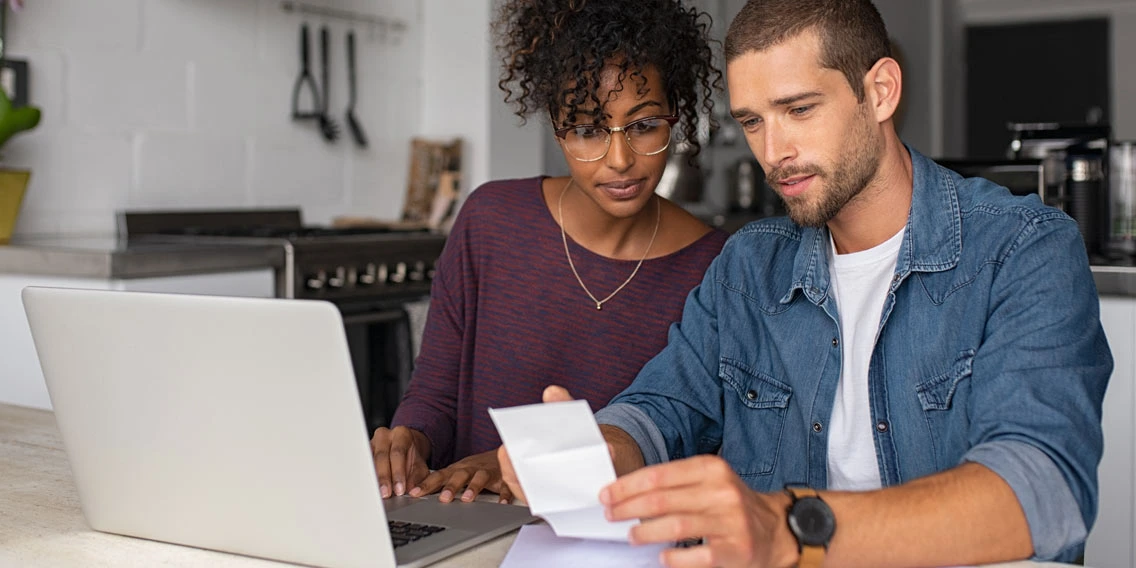 couple looking at joint checking account