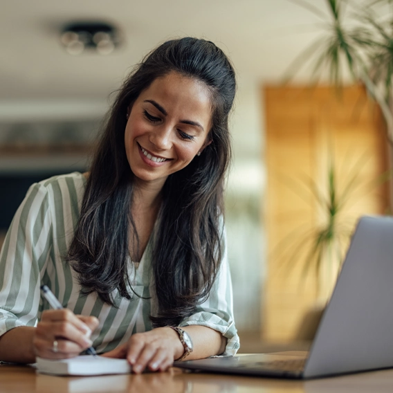 Girl writing on a book