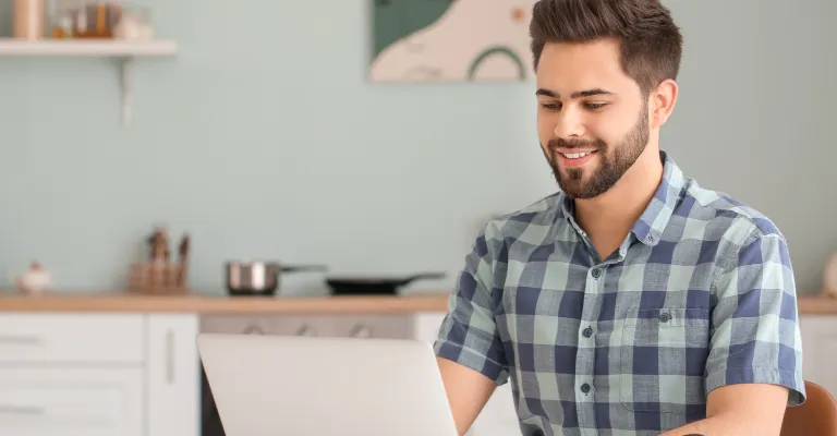 a young man working on laptop