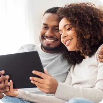 couples holding a tablet in hands