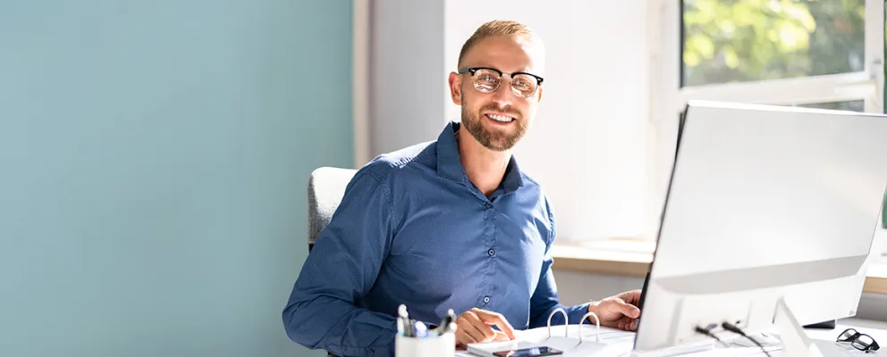 Mortgage agent sitting at his office desk