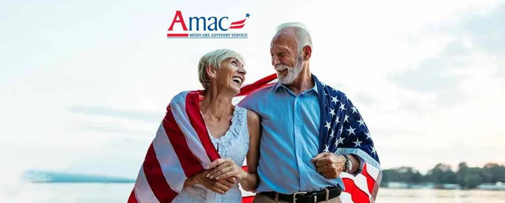 Old couple with an American flag looking at each other and smiling. 