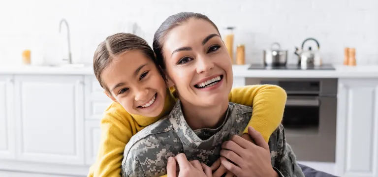  daughter giving a hug to her mother