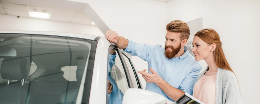 couple standing near the car