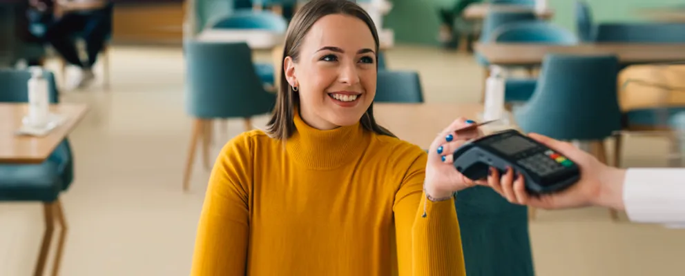 A woman making a mobile contactless payment