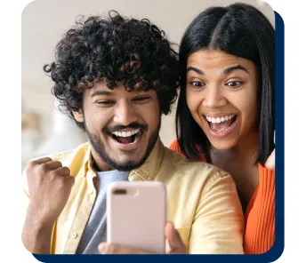 happy couple looking at phone
