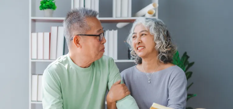 old couple sitting together and smiling