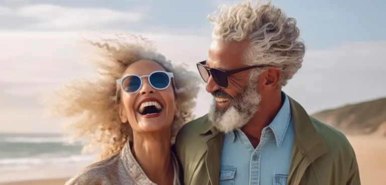 a smiling couple on beach