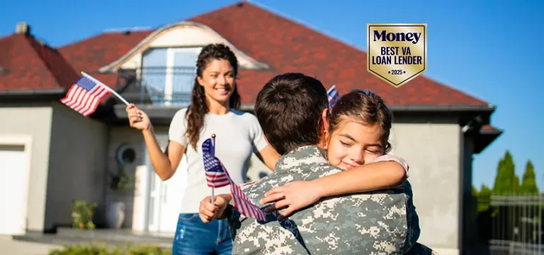 Happy family with dream home, holding U.S flag