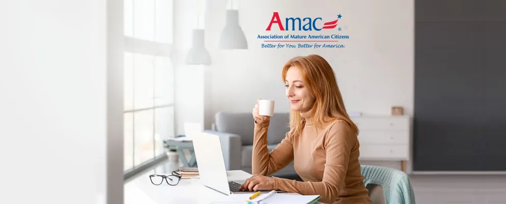 woman having a coffee while working on laptop
