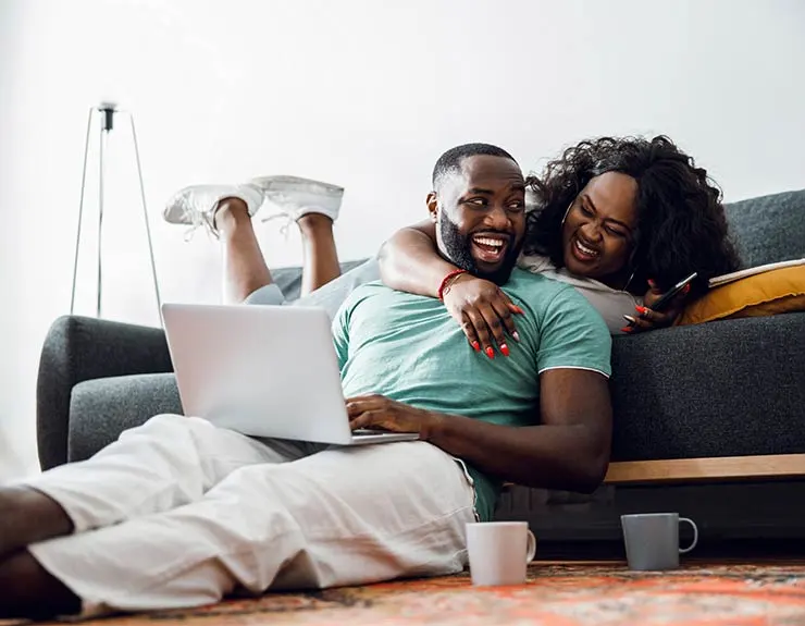 Handsome man laughing with his beloved woman stock photo